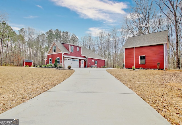 view of front of house featuring a garage and concrete driveway