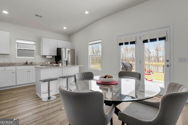 dining room with visible vents, recessed lighting, and light wood-style floors