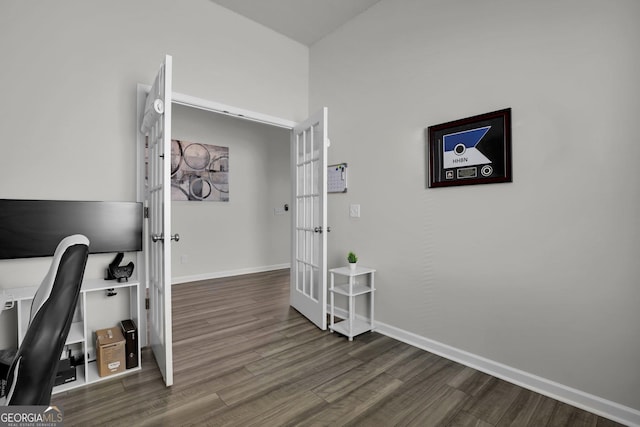 office with wood finished floors, baseboards, and french doors