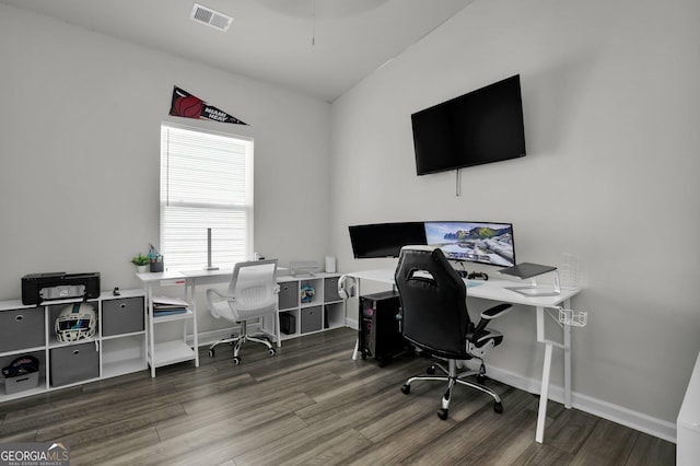 office space with visible vents, baseboards, and wood finished floors