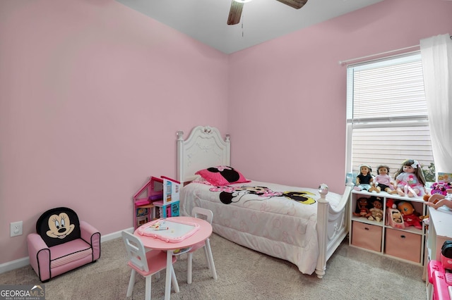 carpeted bedroom with baseboards and a ceiling fan