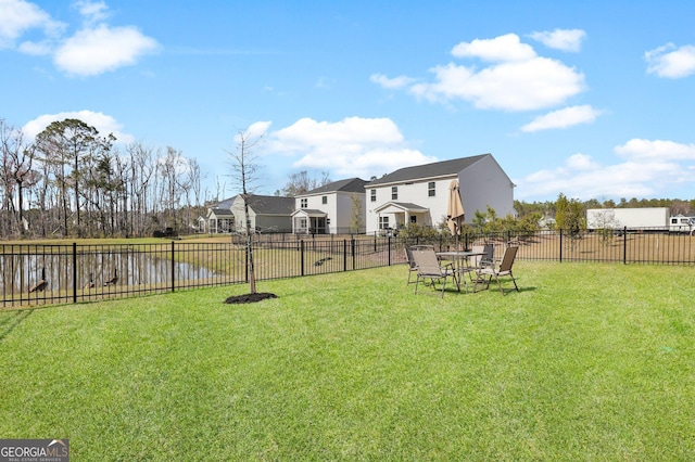 view of yard with a residential view and fence