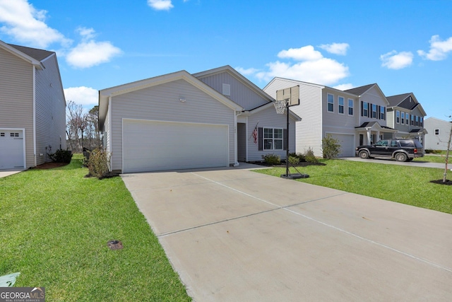 view of front of house with driveway, an attached garage, and a front lawn