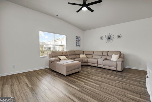 living area with wood finished floors, baseboards, visible vents, lofted ceiling, and ceiling fan