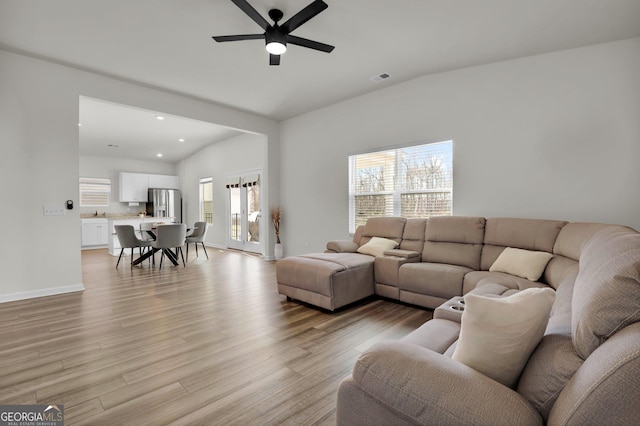 living area with baseboards, visible vents, light wood-style flooring, recessed lighting, and ceiling fan