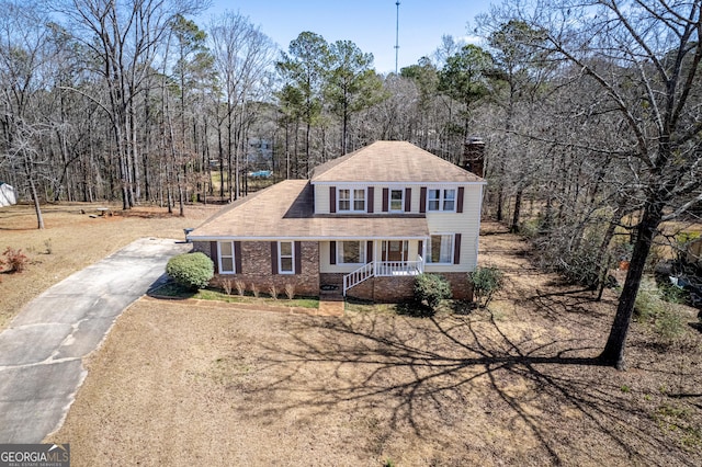 view of front of house featuring brick siding and driveway