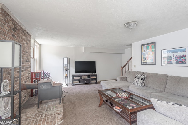 carpeted living area featuring stairway and a textured ceiling