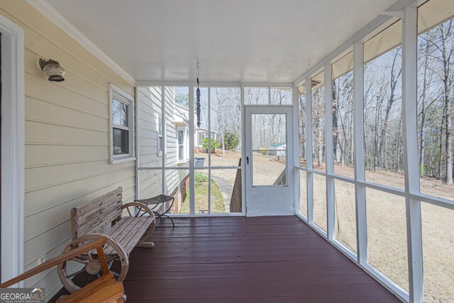 unfurnished sunroom with a healthy amount of sunlight