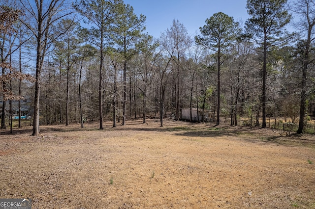 view of yard featuring a view of trees