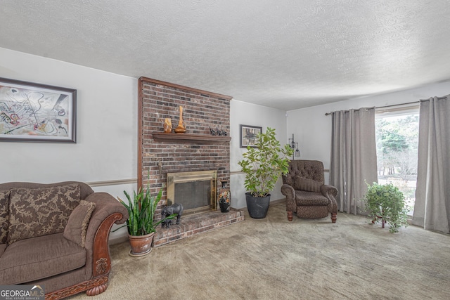 living area with a fireplace, a textured ceiling, and carpet