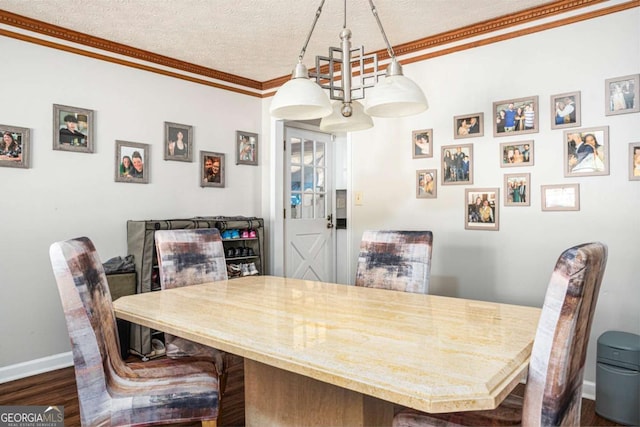 dining area with baseboards, a textured ceiling, dark wood finished floors, and crown molding