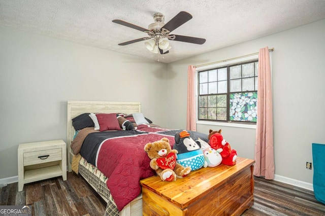 bedroom featuring ceiling fan, wood finished floors, baseboards, and a textured ceiling