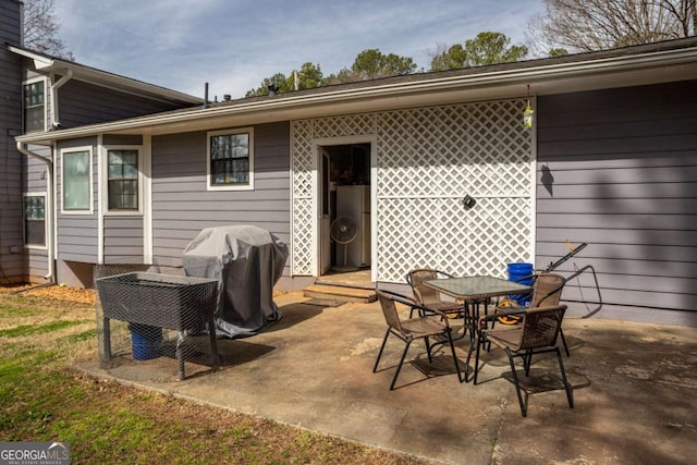 view of patio / terrace featuring outdoor dining area and a grill