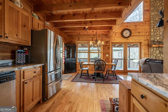 kitchen featuring light wood-type flooring, french doors, wooden walls, appliances with stainless steel finishes, and wood ceiling