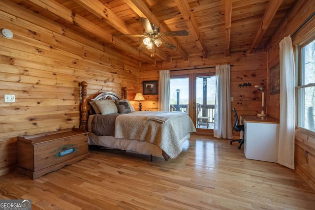 bedroom with multiple windows, wood ceiling, light wood-style flooring, and access to outside