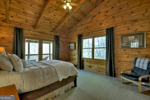 carpeted bedroom with high vaulted ceiling, wooden ceiling, wood walls, beam ceiling, and access to exterior