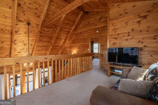 carpeted living room featuring beamed ceiling, wood ceiling, wood walls, and high vaulted ceiling