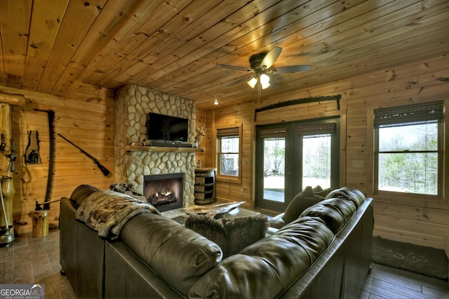 living area featuring wood walls and hardwood / wood-style flooring