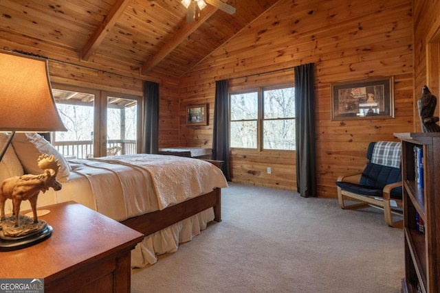 bedroom with access to outside, lofted ceiling with beams, wood walls, light colored carpet, and wood ceiling