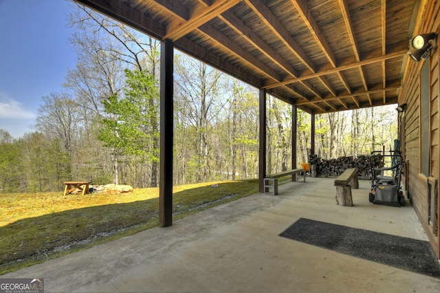 view of patio / terrace with a view of trees