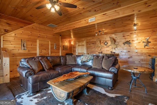 living area featuring wooden ceiling, wood finished floors, visible vents, and ceiling fan