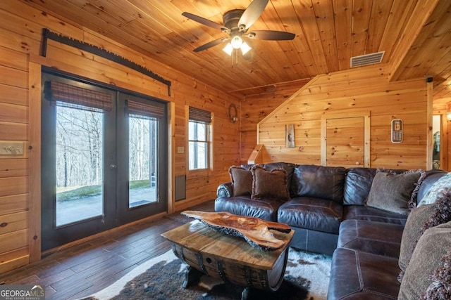 living area with wooden walls, visible vents, french doors, wood ceiling, and wood-type flooring