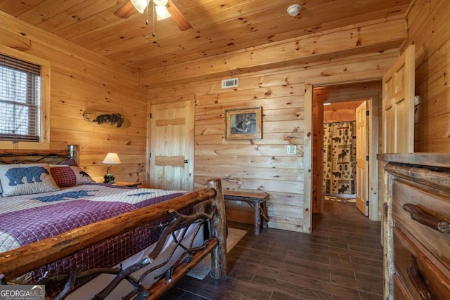 bedroom featuring visible vents, wooden ceiling, dark wood-type flooring, and wooden walls