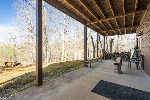 view of patio / terrace featuring a forest view