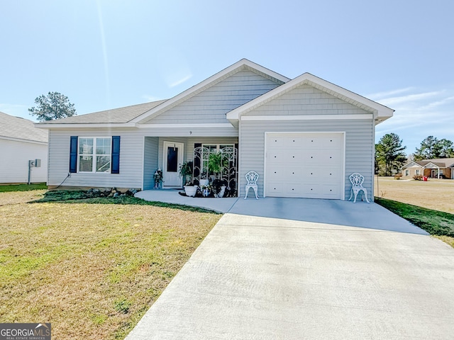 single story home with an attached garage, concrete driveway, and a front yard