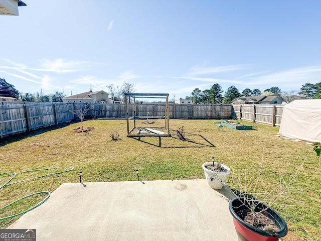 view of yard with a patio and a fenced backyard