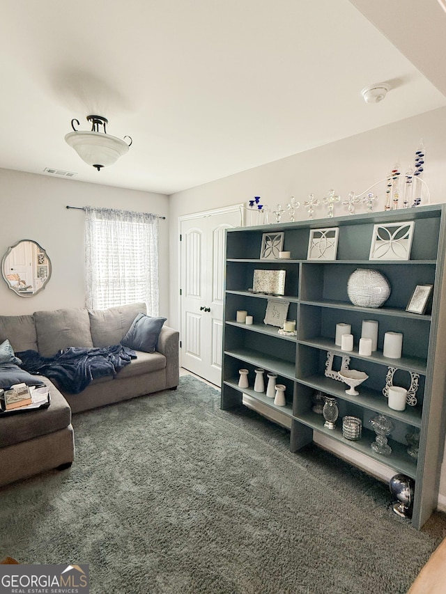 living room with visible vents and carpet floors