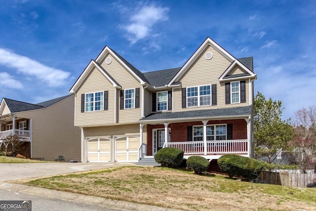 view of front facade featuring covered porch, concrete driveway, a front yard, a garage, and brick siding