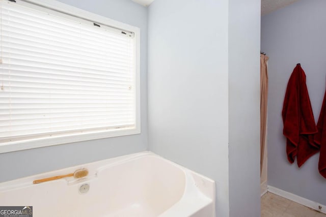 bathroom with a shower with shower curtain and a bath