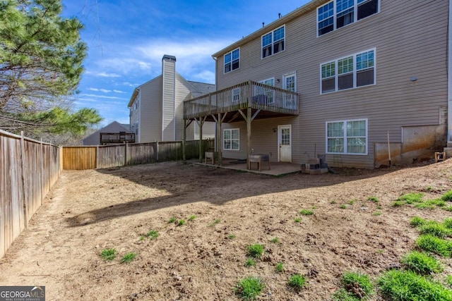 back of property featuring a patio area and a fenced backyard