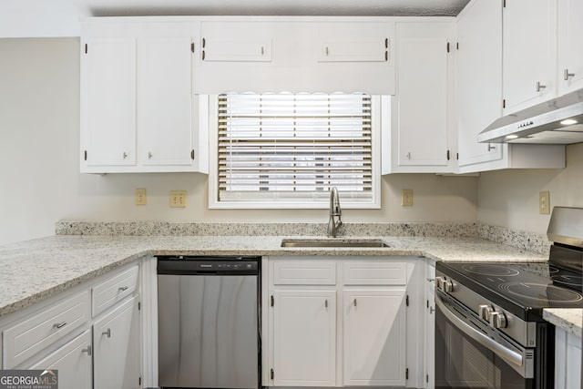 kitchen with under cabinet range hood, white cabinets, appliances with stainless steel finishes, and a sink