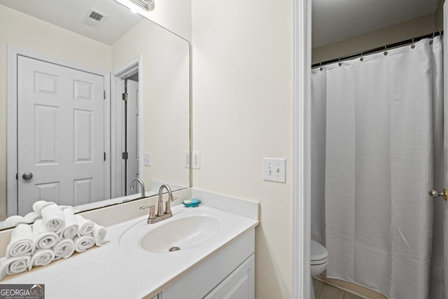 bathroom featuring vanity, visible vents, toilet, and a shower with curtain