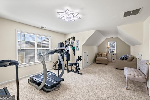 workout room with carpet flooring, baseboards, and visible vents