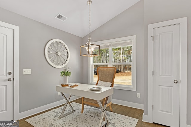 office area with wood finished floors, visible vents, baseboards, an inviting chandelier, and lofted ceiling