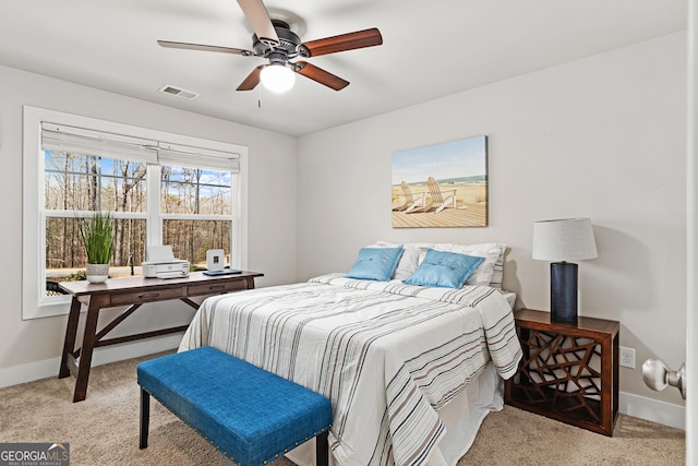 bedroom with visible vents, a ceiling fan, baseboards, and carpet floors