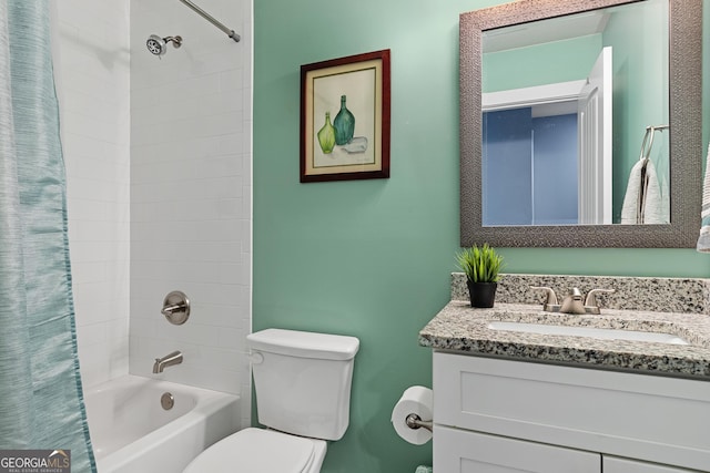 full bath featuring toilet, vanity, and shower / tub combo