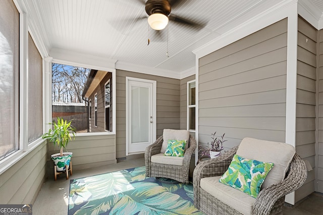 sunroom with a ceiling fan