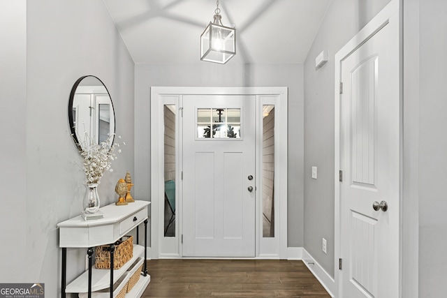 entrance foyer with dark wood-style floors and baseboards