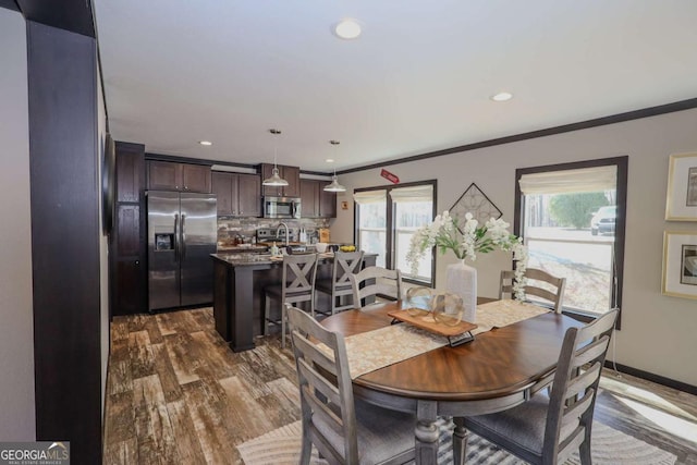 2802 County Road 19, Woodland, AL 36280 - dining room with dark wood-style floors, recessed lighting, and crown molding