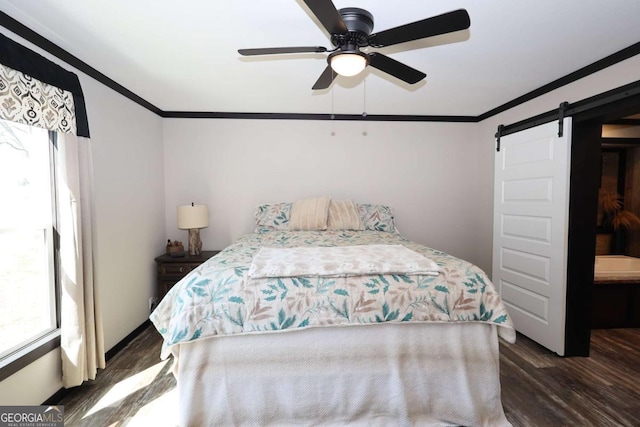 2802 County Road 19, Woodland, AL 36280 - bedroom featuring ornamental molding, wood finished floors, a barn door, and a ceiling fan