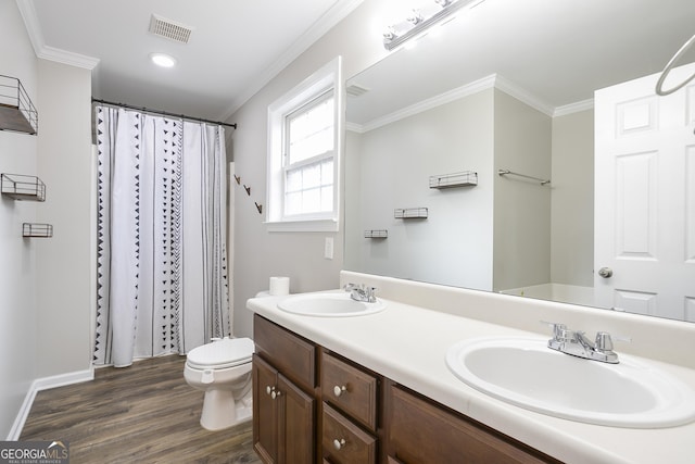 full bathroom with crown molding, wood finished floors, visible vents, and a sink