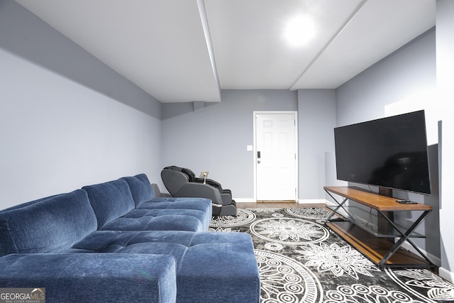 living room with wood finished floors and baseboards