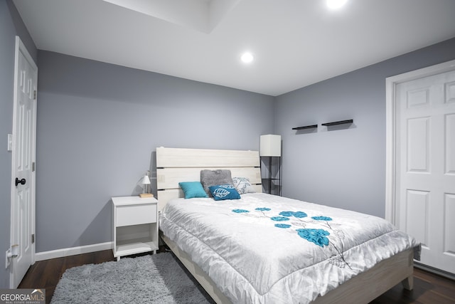 bedroom with recessed lighting, baseboards, and wood finished floors