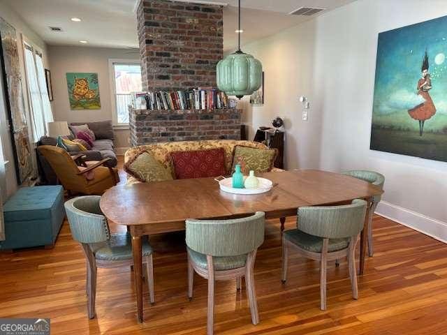 dining area with visible vents, recessed lighting, baseboards, and wood finished floors