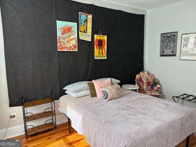 bedroom featuring light wood-style floors