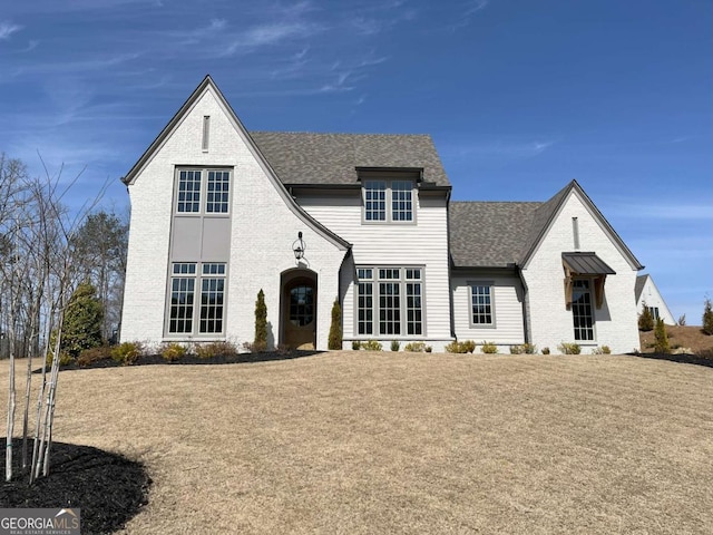 64 Telfair Ct, Acworth, GA 30101 - tudor-style house featuring brick siding and roof with shingles